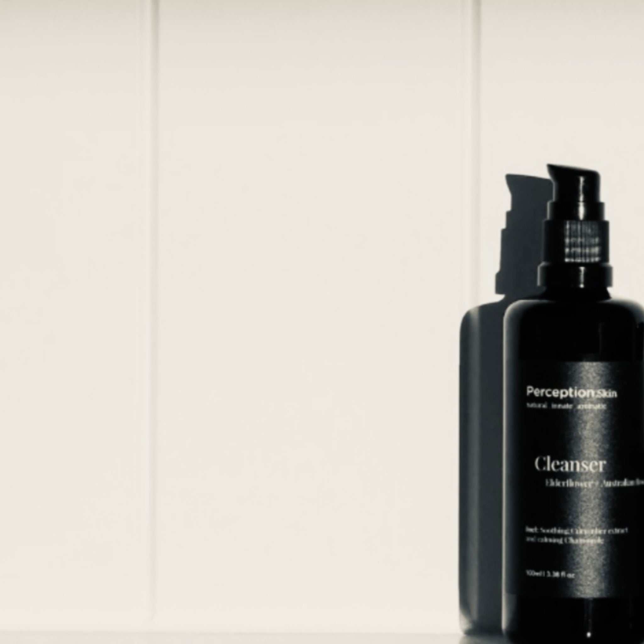 Image of Perception Skin Elderflower + Australian Rose Cleanser with a white wooden background