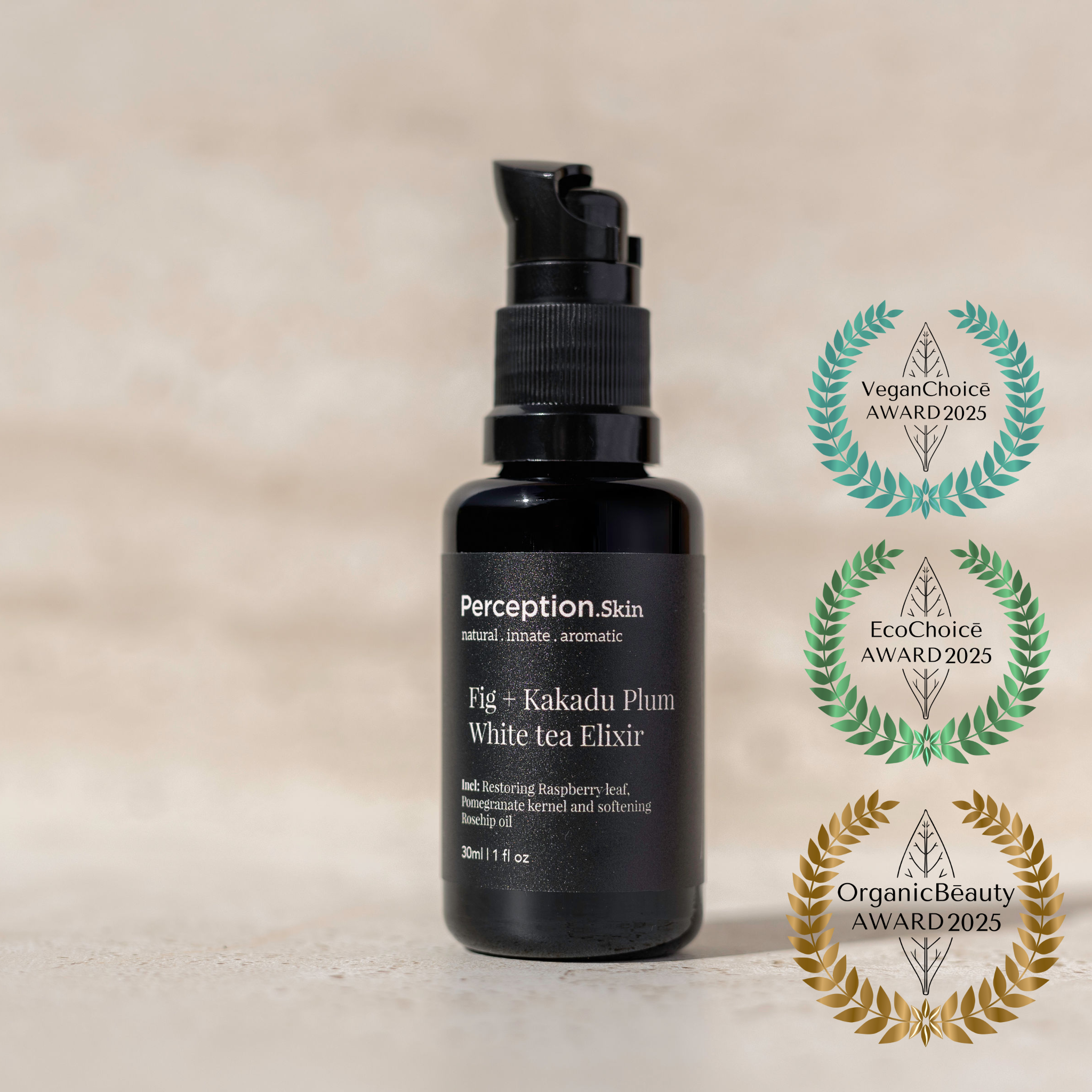 Black bottle of Perception Skin Fig + Kakadu Plum elixir with three Organic Beauty Awards rosettes award logos on a beige background