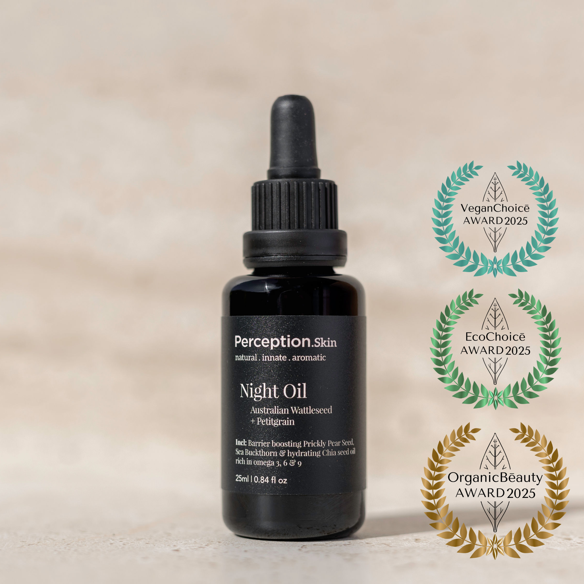 Black bottle of Perception Skin Night Oil with Organic Beauty Awards 2025 rosette awards on a beige background