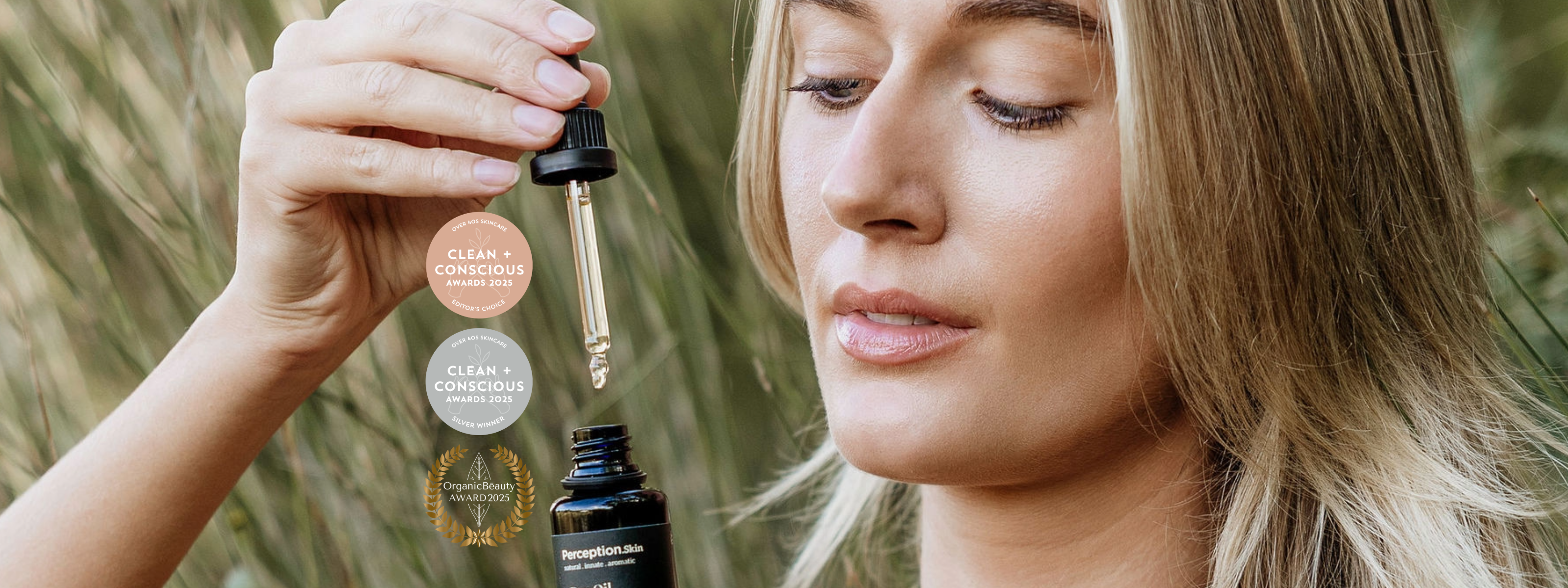 Model holding Perception Skin Day Oil with Clean + Conscious Award logos and Organic Beauty Awards logo 2025