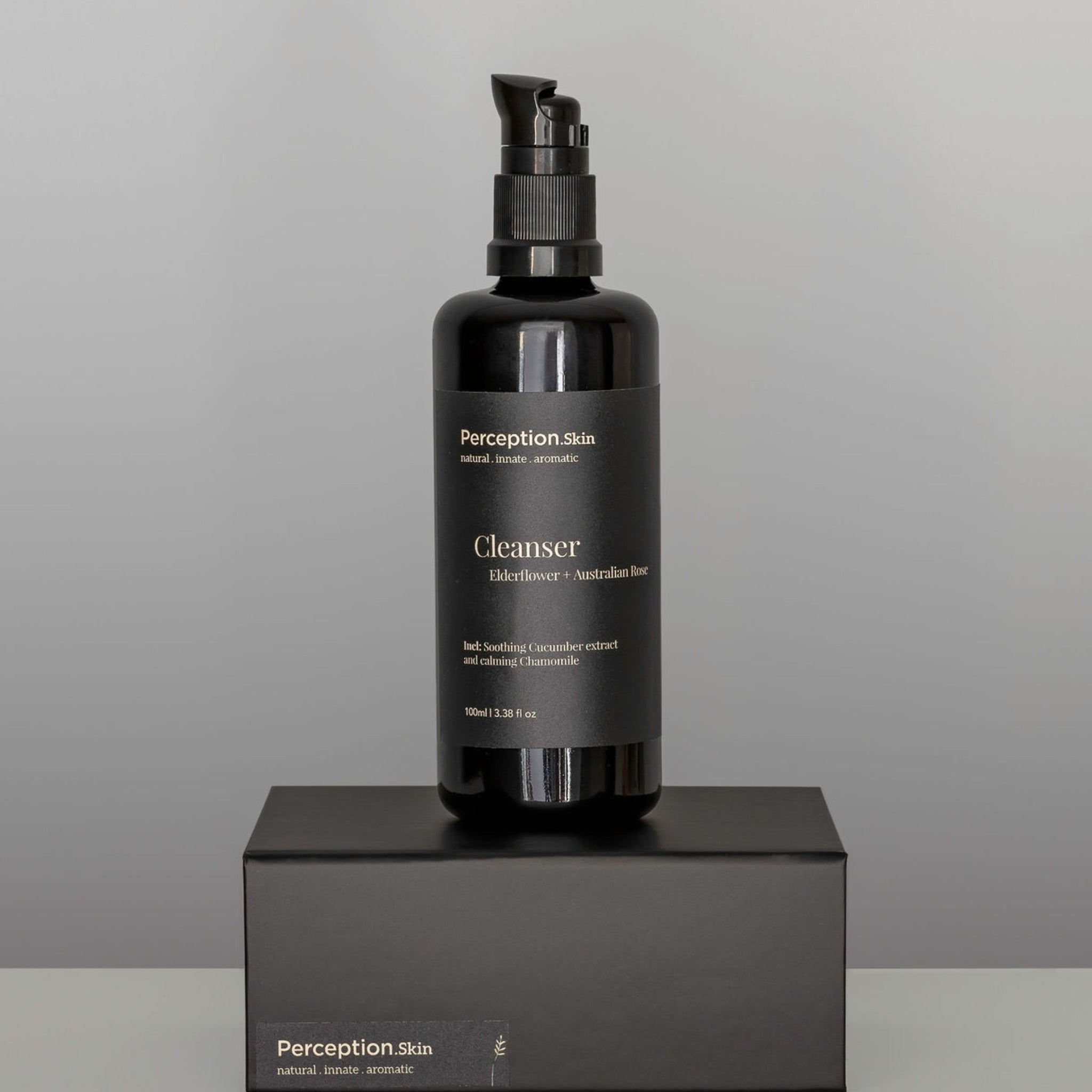 Perception Skin Elderflower + Australian Rose Cleanser sitting on a black box