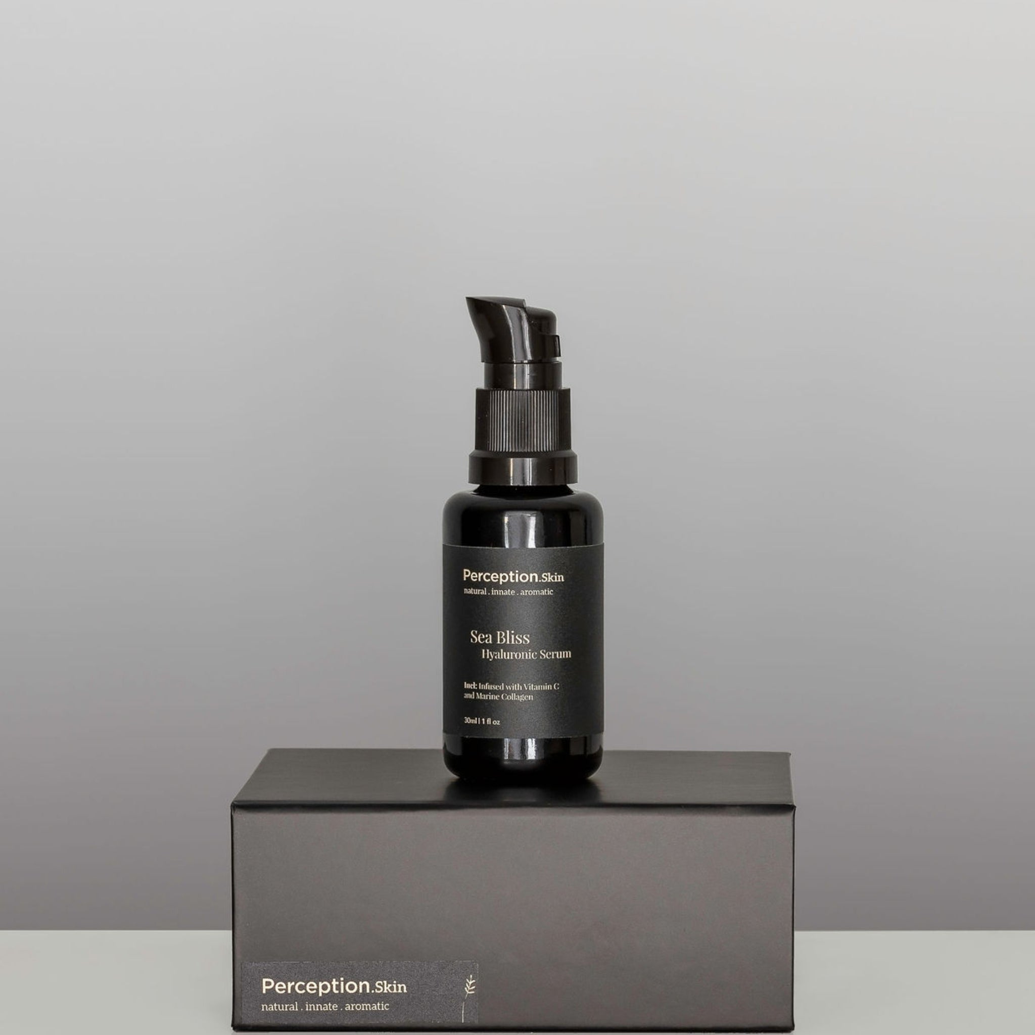 Perception Skin Sea Bliss Hyaluronic Serum, sitting on black box - Vegan based