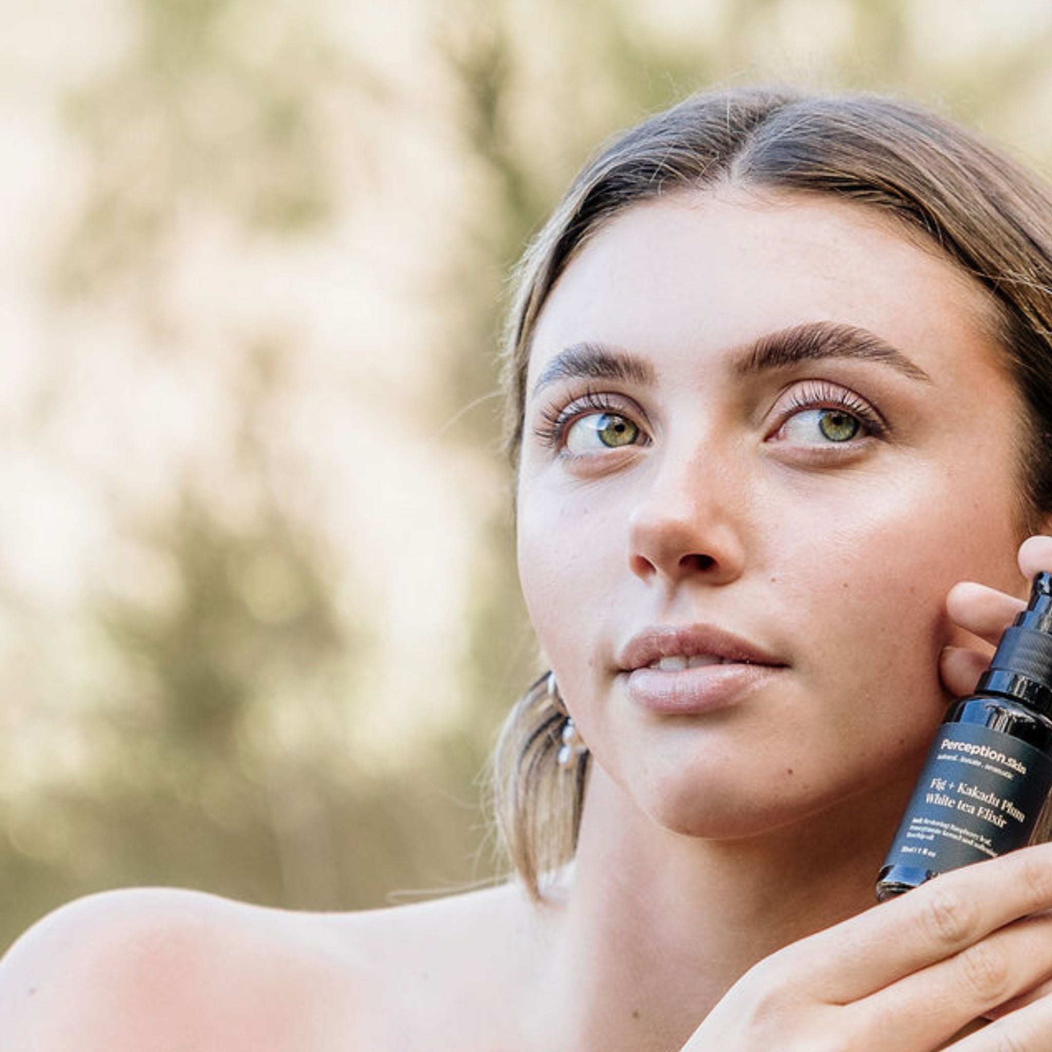 Model showcasing Perception Skin Fig + Kakadu Plum White tea Elixir