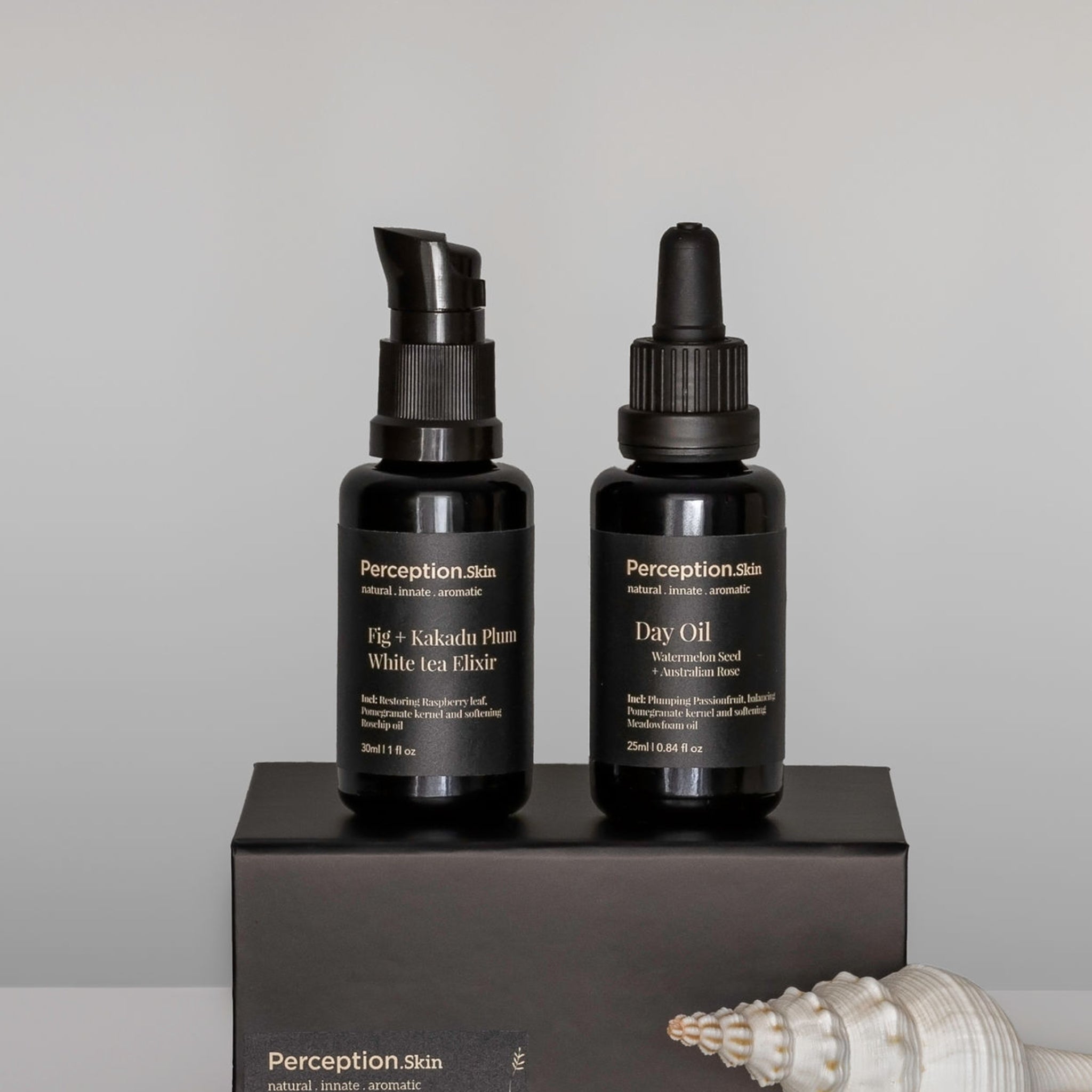 Perception Skins Synergy Boost Kakadu Plum and Australian Rose sitting on a black box Duo